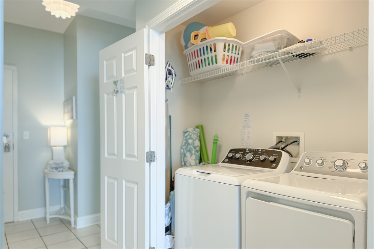 This well-equipped utility closet offers ample storage and a in-unit washer/dryer for your everyday needs.
