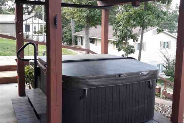 Enjoy the covered patio hot tub jacuzzi with waterfalls and LED lighting. 