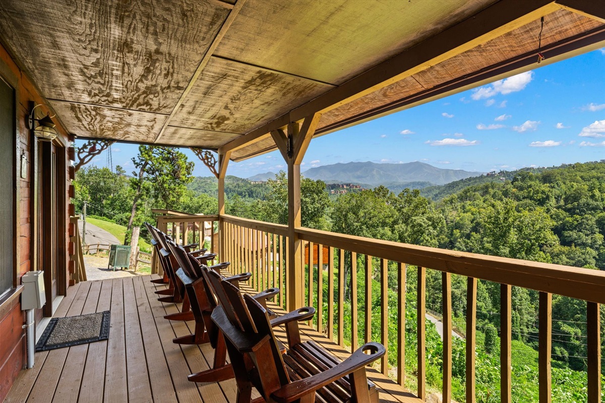 Rocking chairs for everyone on the deck. Memories are made here. The view of Mount LeConte is amazing.