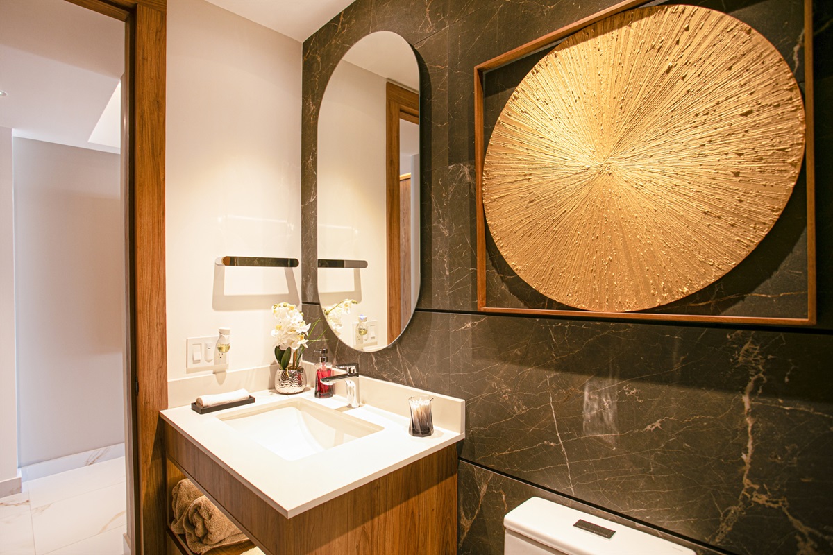 Stylish touches and a contemporary sink area give the second bathroom a fresh, spa-like feel.