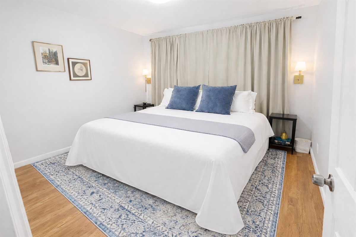 Enjoy a serene bedroom with premium linens, soft lighting, and a clean, modern design—perfect for relaxing after a long day.