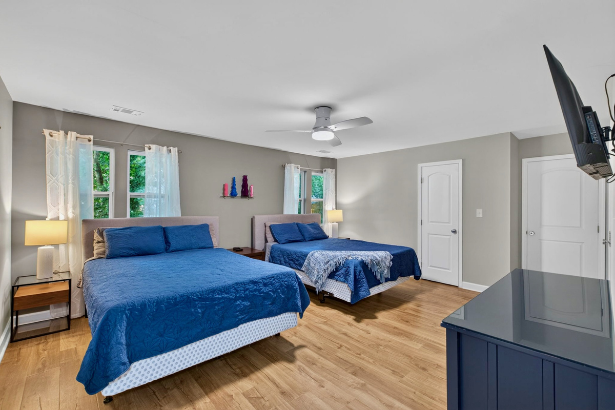The queen bedroom features two memory foam mattresses, a closet and large dresser. This bedroom is attached to the full bathroom upstairs.