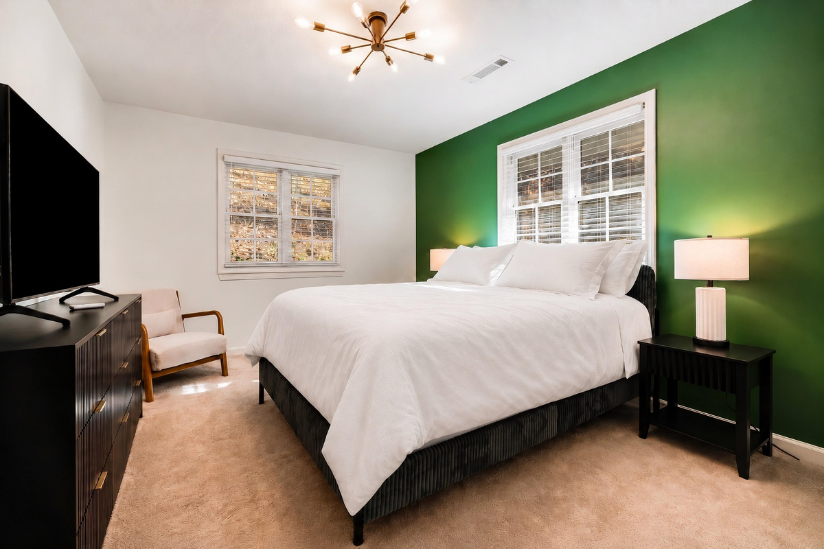 The guest bedroom is located on the upper level and features a comfortable queen be