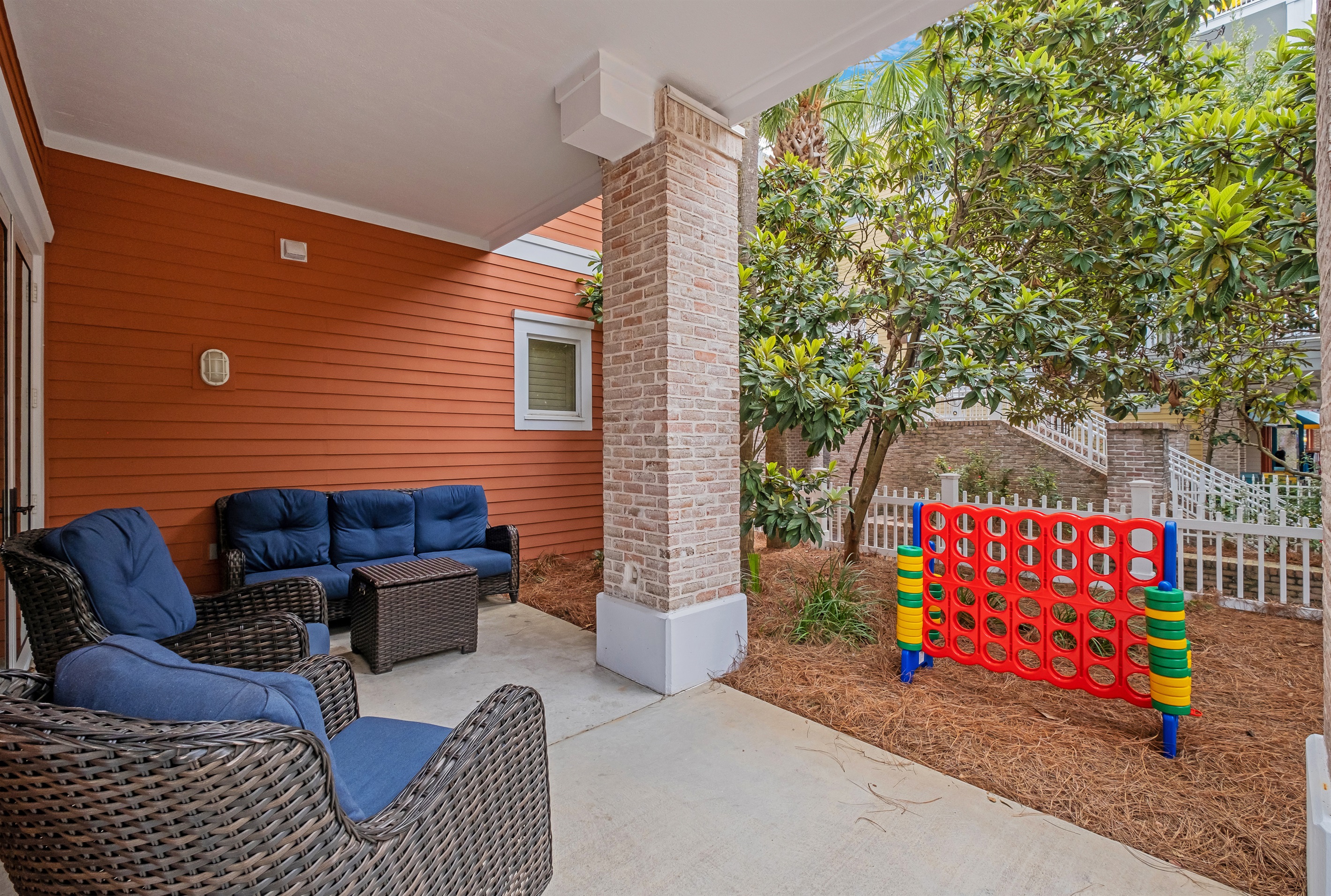 Enjoy family time with a large Connect 4 game in this cozy outdoor area. A great spot to entertain guests or simply relax in comfort.