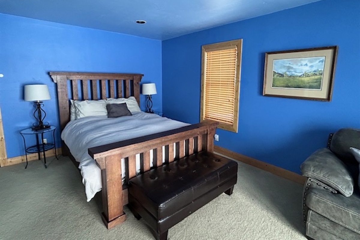 Queen size bed in primary bedroom