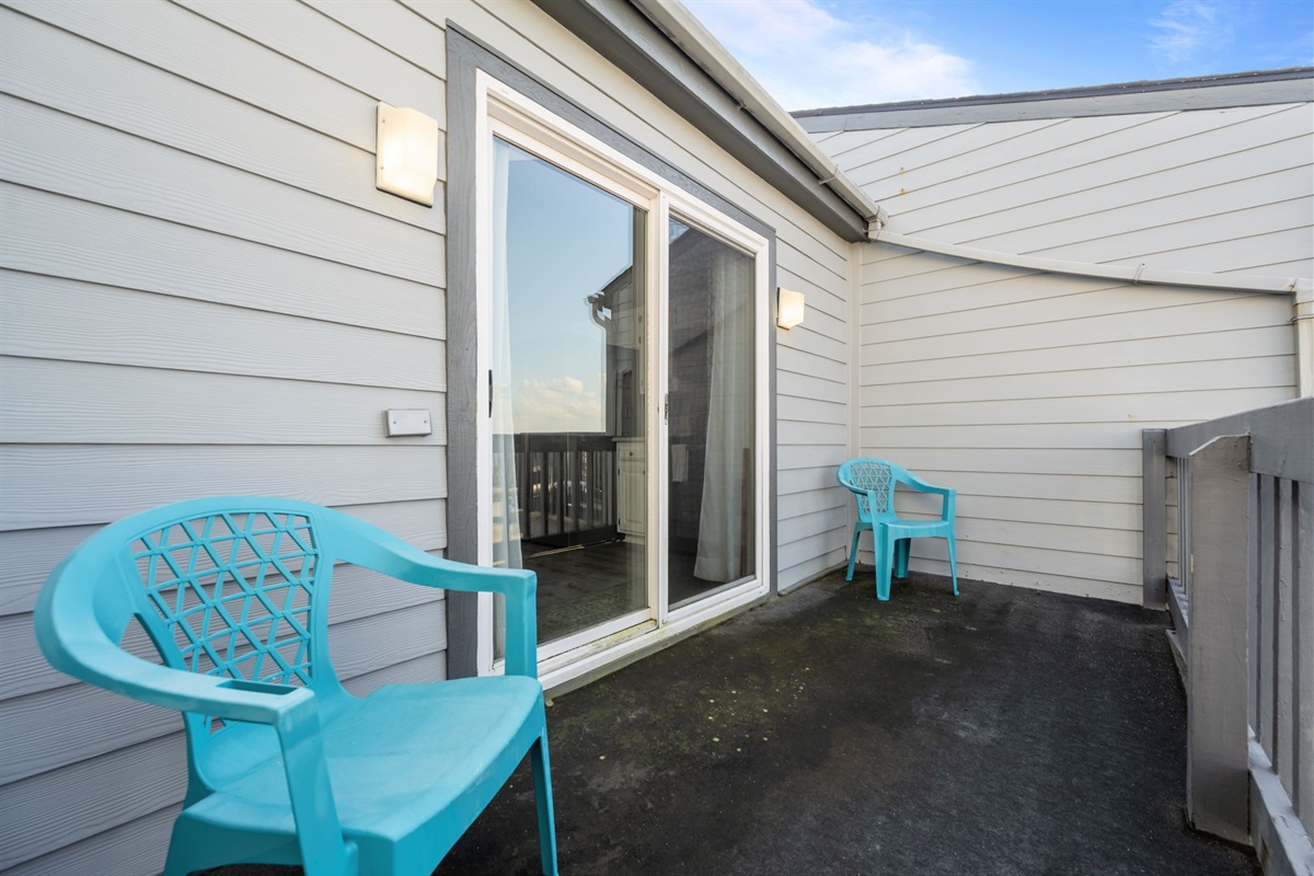 Quiet balcony just off the bedroom, a great spot for morning coffee or an evening breeze