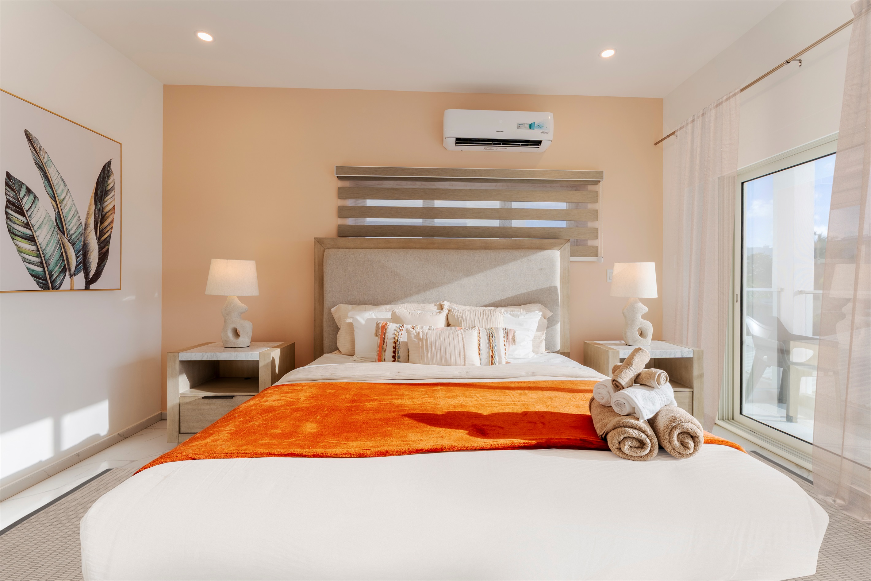 Premium linens and a calming palette ensure a restful night's sleep