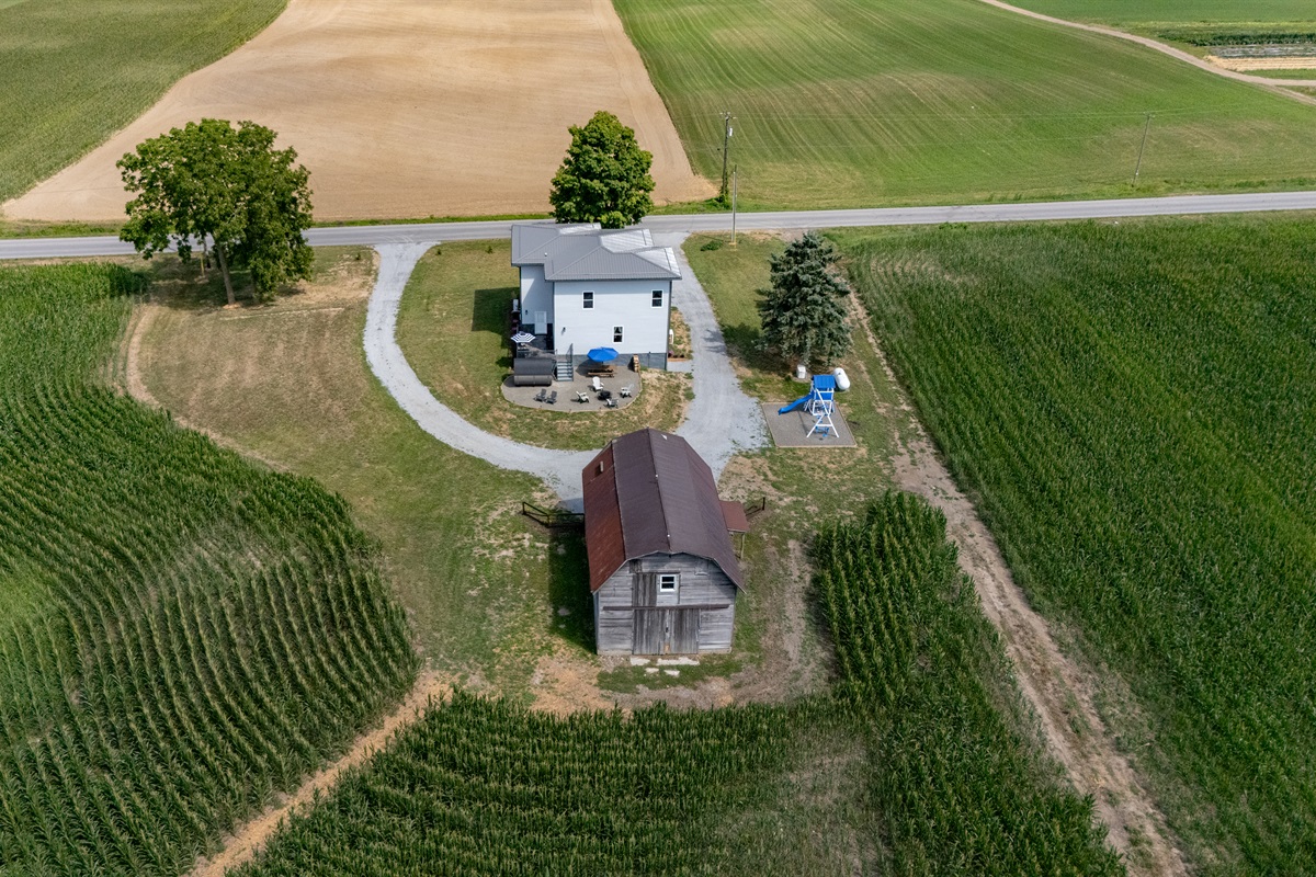 Expansive country charm with wide-open fields, private driveway, and a peaceful homestead retreat surrounded by nature.