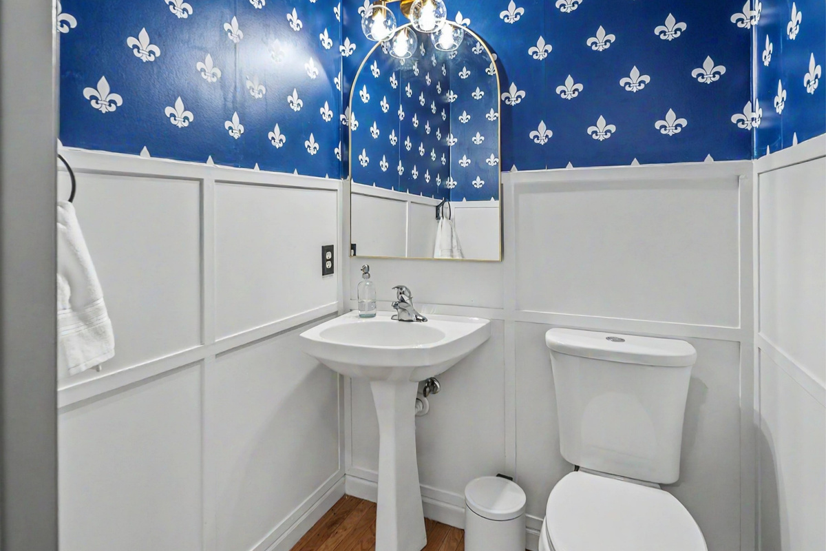 Convenient main-floor half bath with St. Louis-inspired design touches.