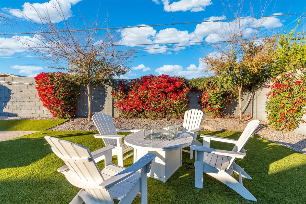 Bright and inviting table and chairs setup, creating a warm ambiance during the day, perfect for outdoor meals or relaxation.