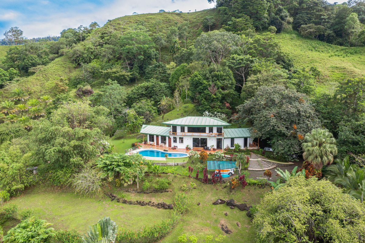 Aerial view of Casa Infinity set within the lush jungle of the Hills of Portalón