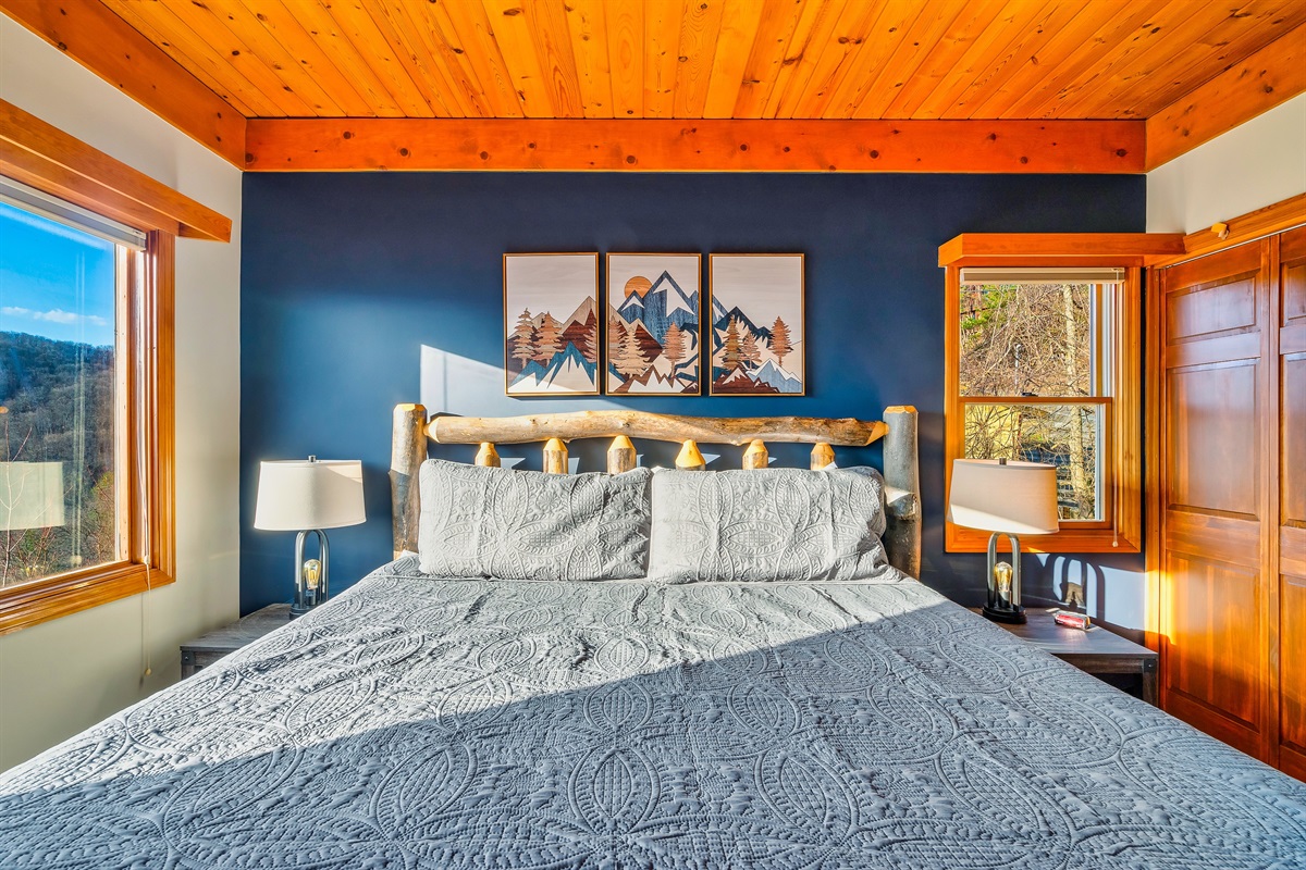 Upstairs King bedroom with premium bedding & pillows to unwind after a day exploring Gatlinburg