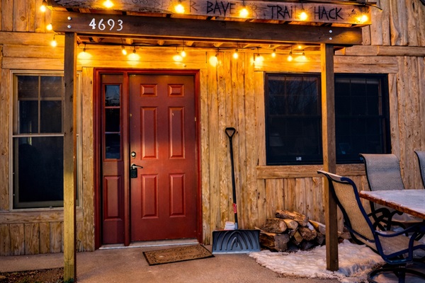 This is where it begins. Soft string illuminates the front door, creating a welcoming look that feels charming, comfortable, and unmistakably North Shore! This is the one, you found the perfect getaway spot.