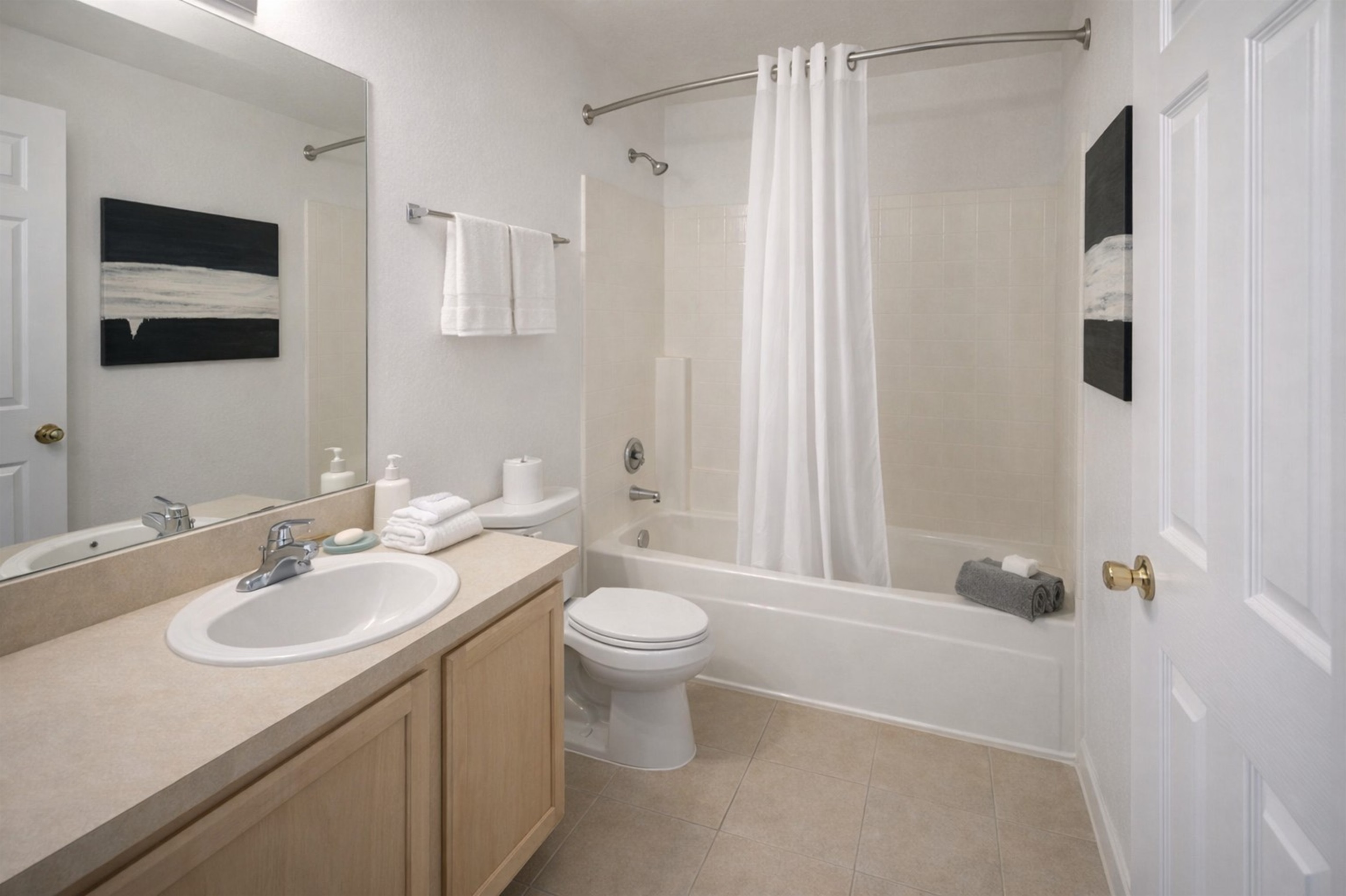 Clean and modern bathroom with a bathtub and shower combination