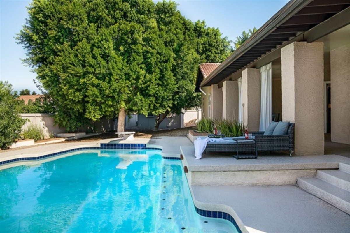 Unwind by the heated pool with plush seating and total privacy for the perfect desert getaway.