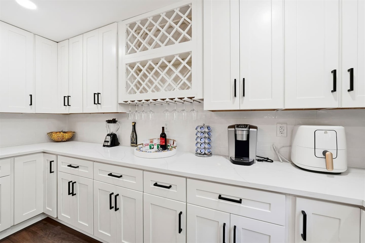 Beautiful white kitchen fully equipped with all the appliances and essentials of a home away from home.