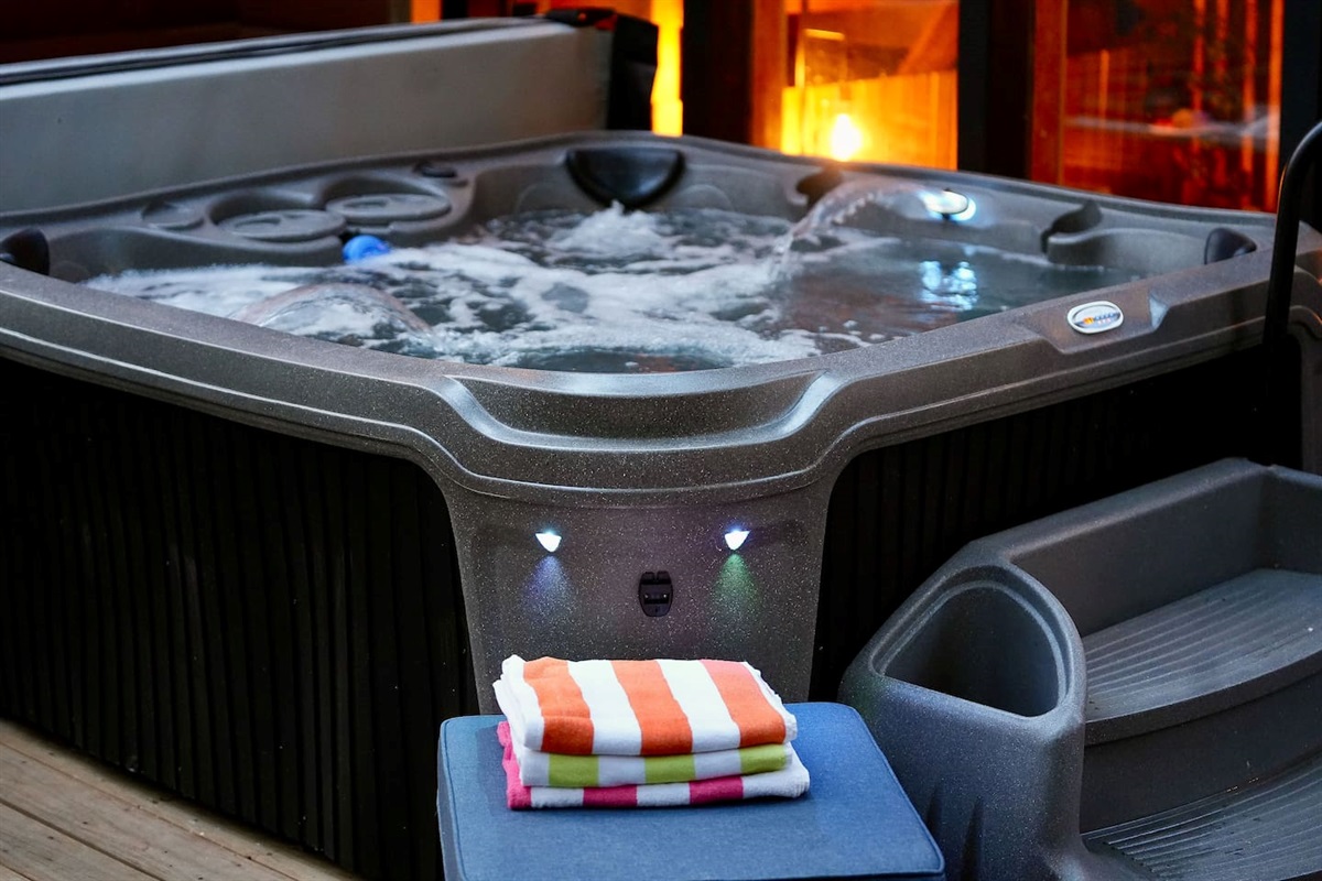 Relax under the cafe lights at night in this 7 person hot tub.
