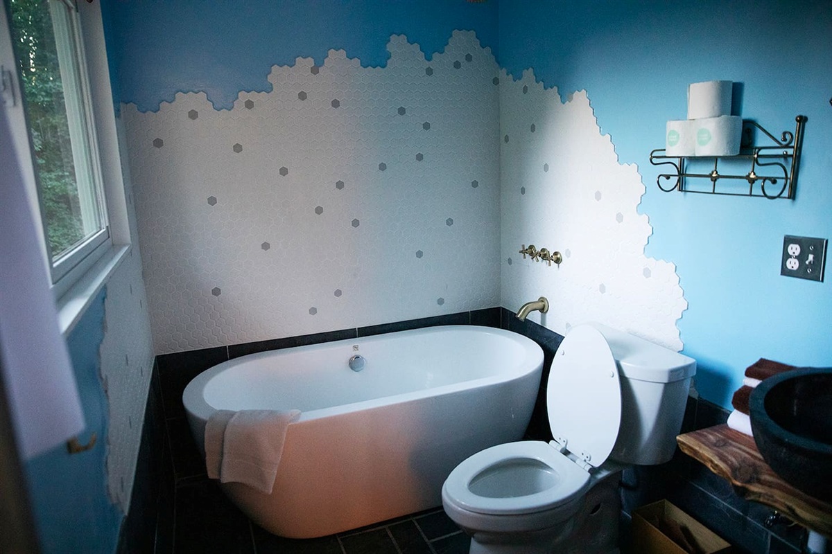 bathroom with shower and tub
