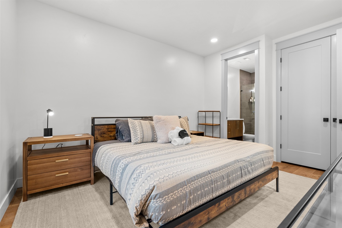 Primary bedroom with king bed — quiet comfort for relaxing.