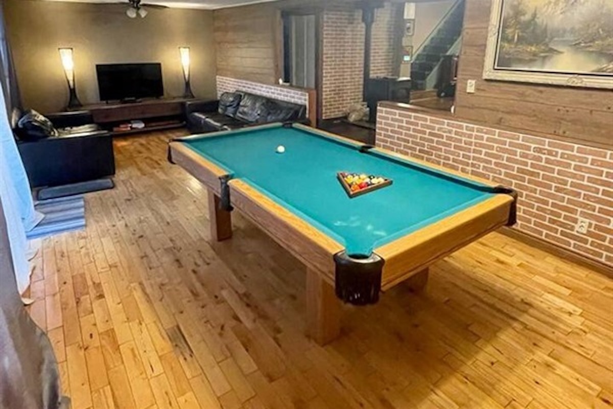 Pool table and lounge area inside the Main House
