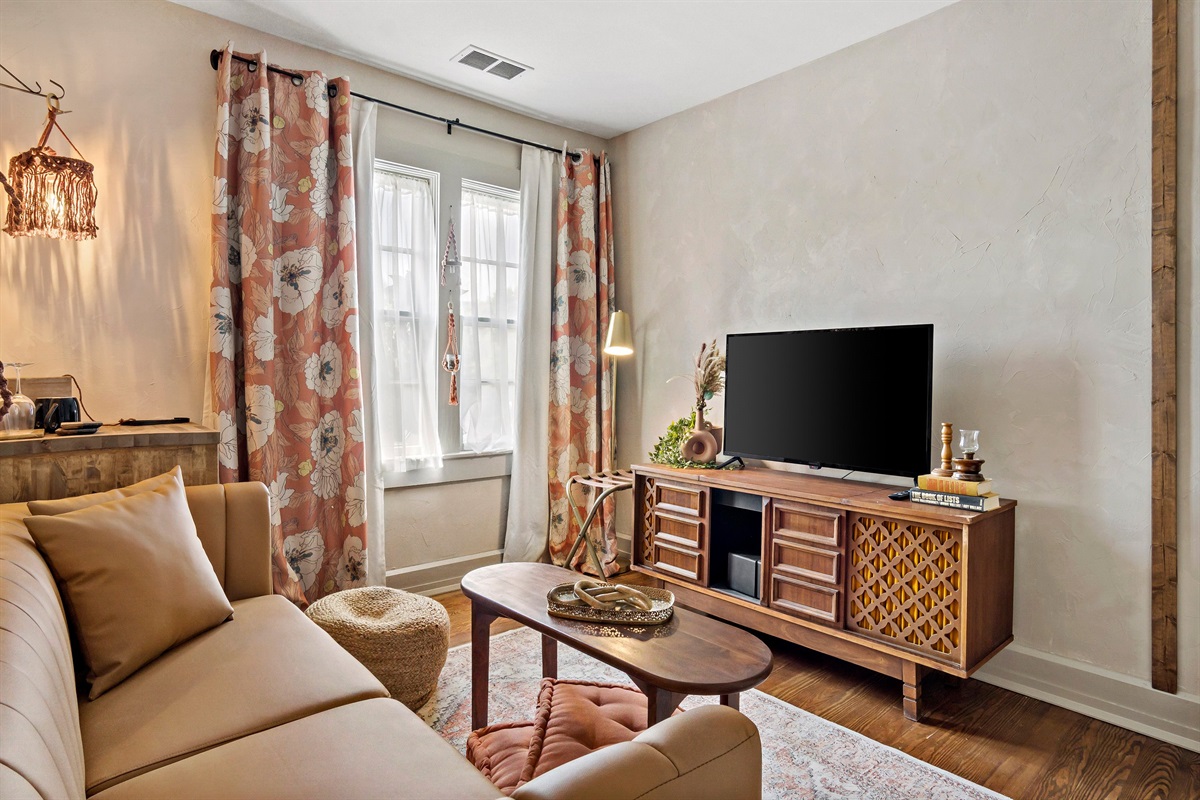 Sitting Area with TV and Mini Fridge. Separated from the bedroom area.