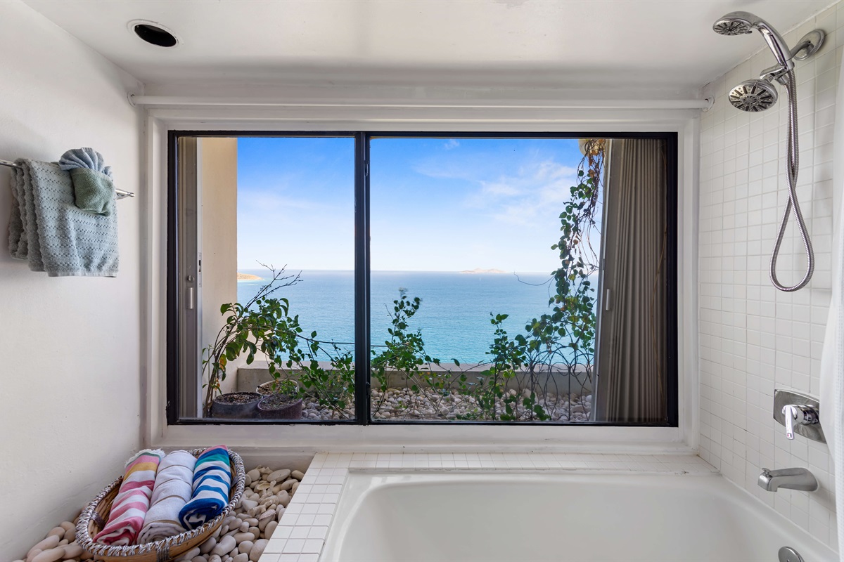 Unwind with island luxury in this bright, spacious bathroom retreat.