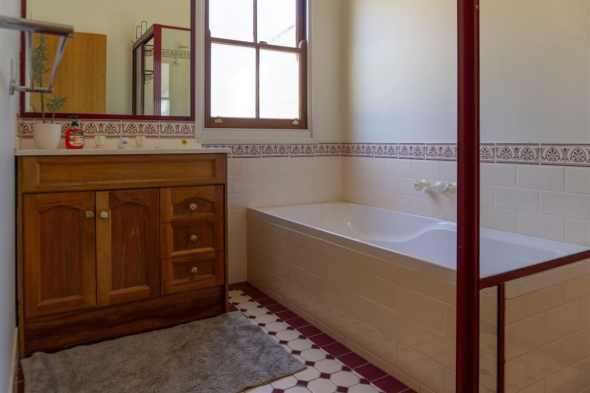 Shared Bathroom with Shower and Bath