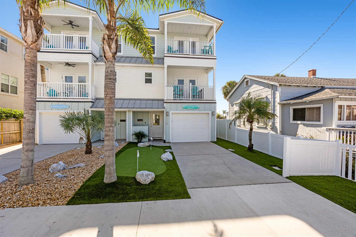 Front exterior showing driveway and entry