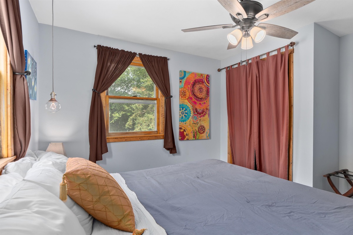 The upstairs king bedroom overlooks the backyard.