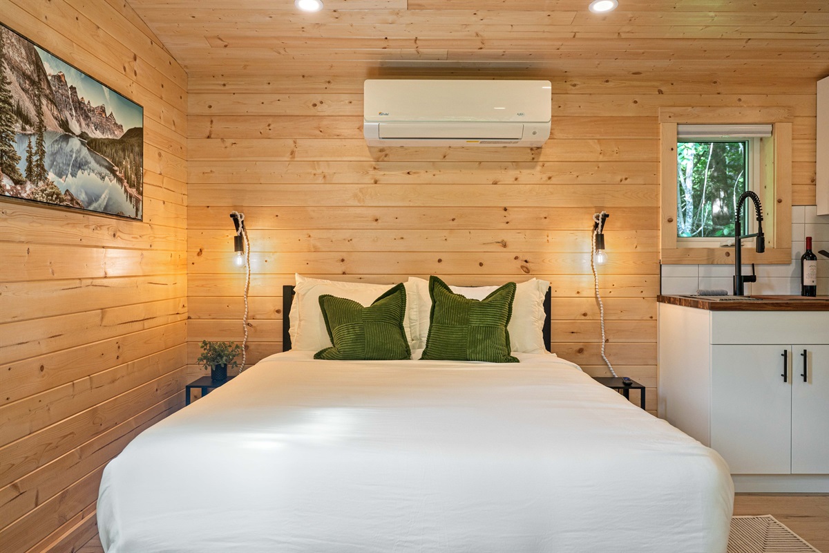 Queen bed with premium bedding and Douglas mattress