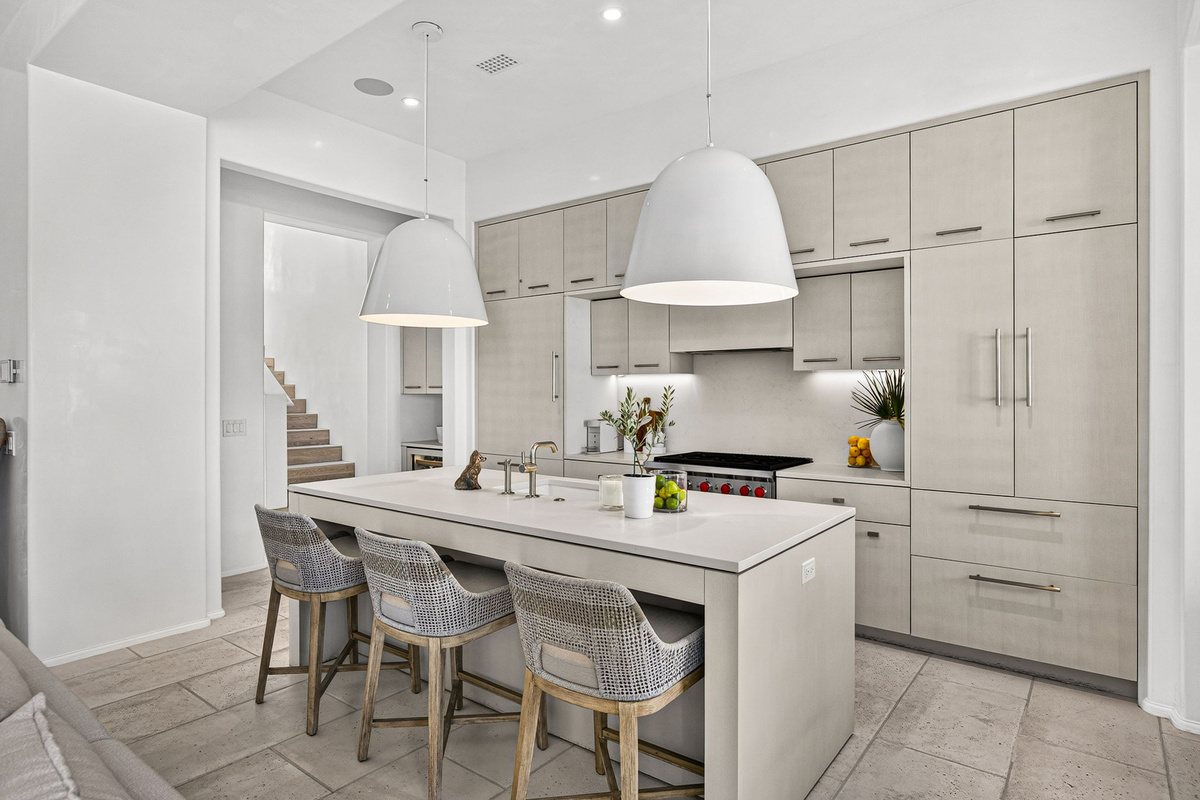 The kitchen offers a 36" Wolf Range, SubZero Refrigerator and freezer, and a wine cooler for your enjoyment.