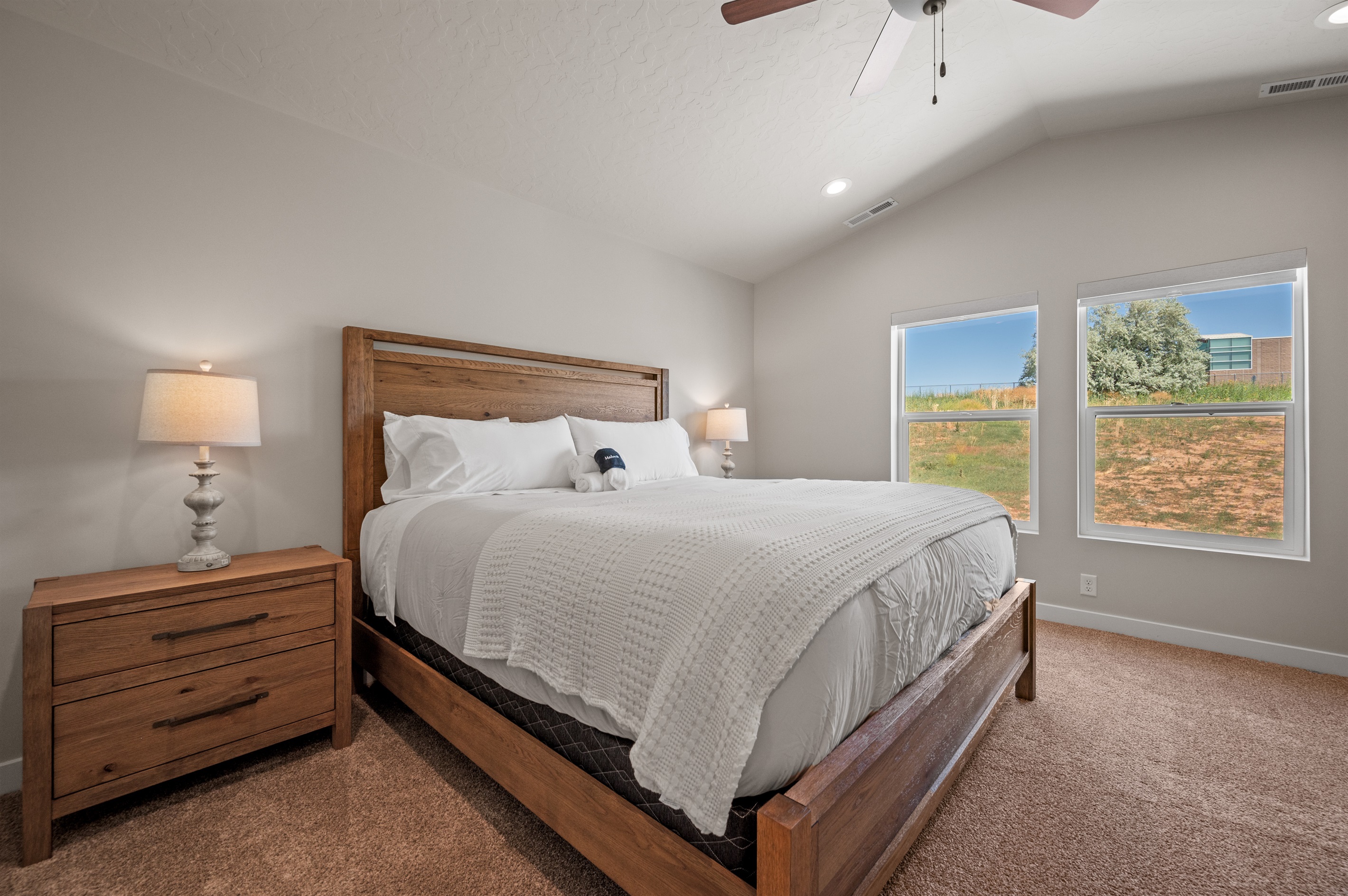 The primary bedroom is filled with natural light, perfect for a peaceful atmosphere.