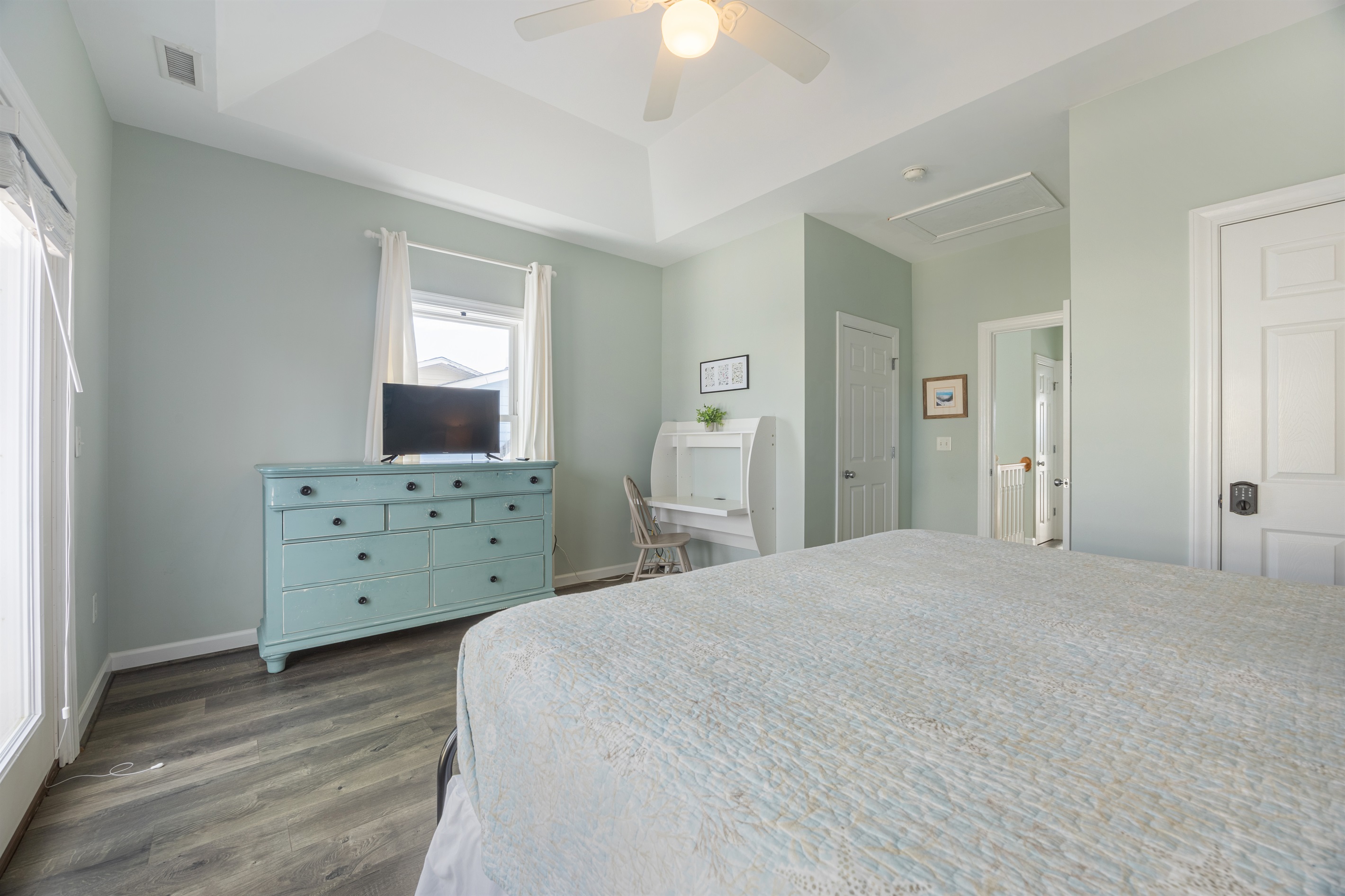 TV and dresser offer comfort, convenience, and organization during your stay