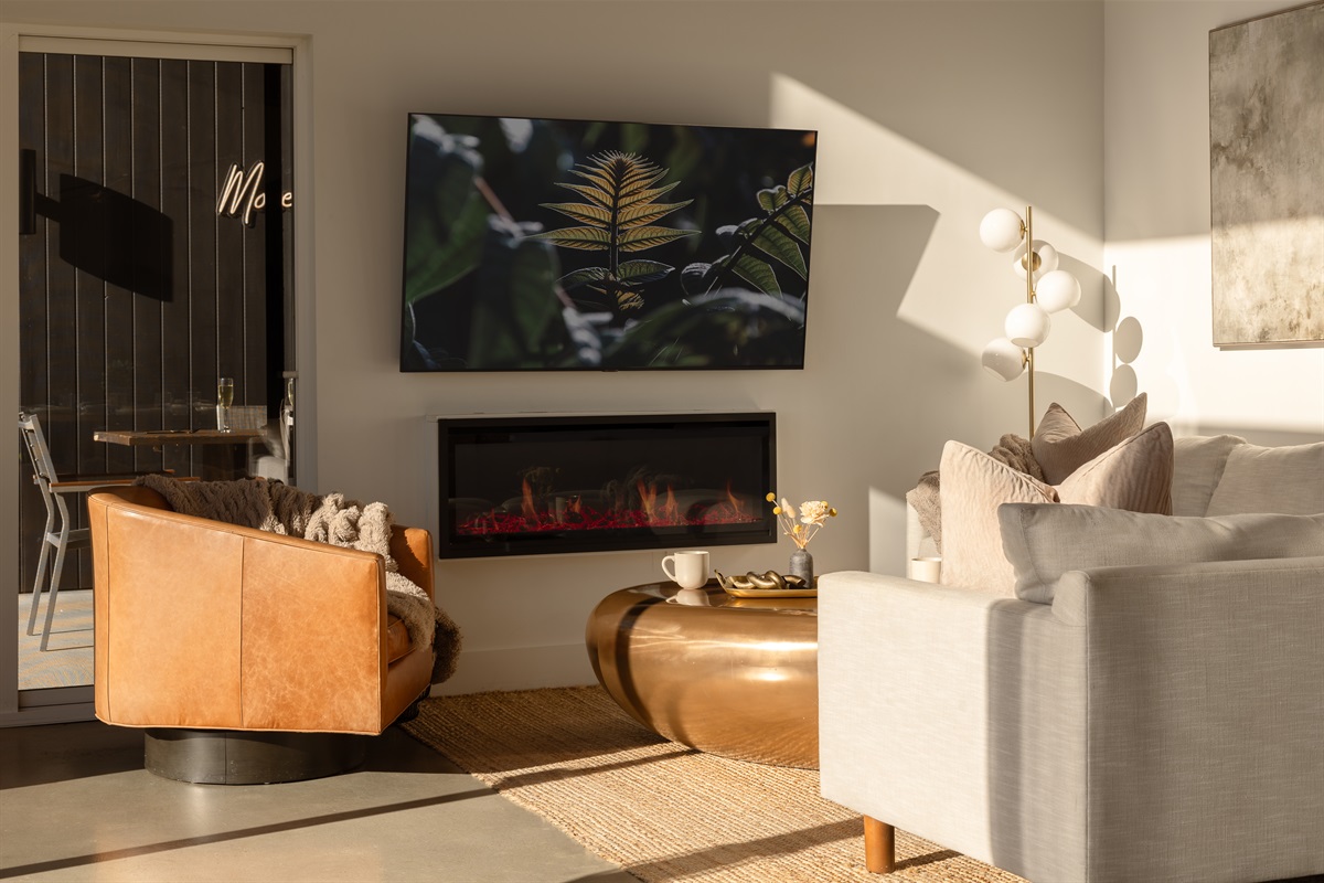 {Fireplace} Sunset light and a glowing fire—your perfect evening at Glass House.