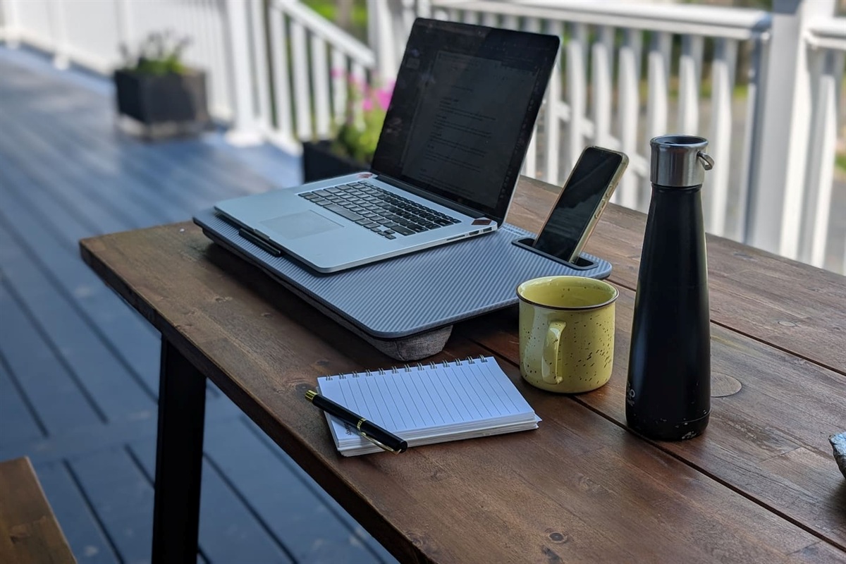 Soak up the sun and enjoy the crisp fall air while working outside with this portable laptop desk. It even has a convenient spot for your cell phone.