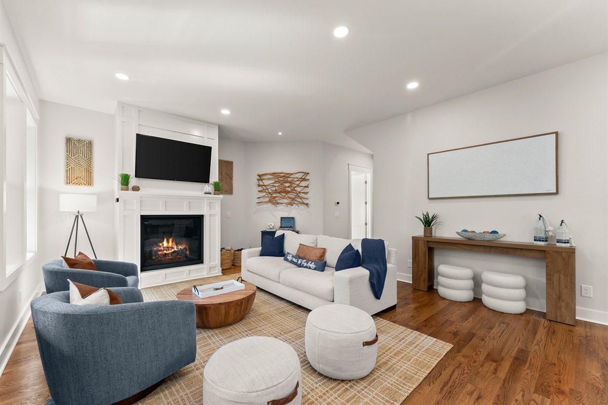 Light-filled living room with gas fireplace and Smart TV — relax, reconnect, unwind.