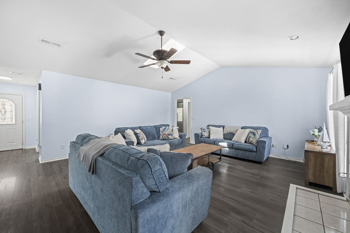 Spacious and airy, this living room comfortably seats the whole crew with easy flow to the front entry and beyond.