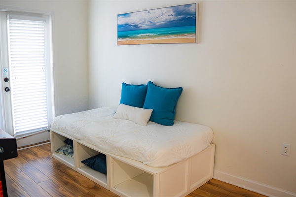 The loft has a twin daybed, TV, and direct access to the balcony, a fun bonus space that works great for kids or teens who want their own hangout.