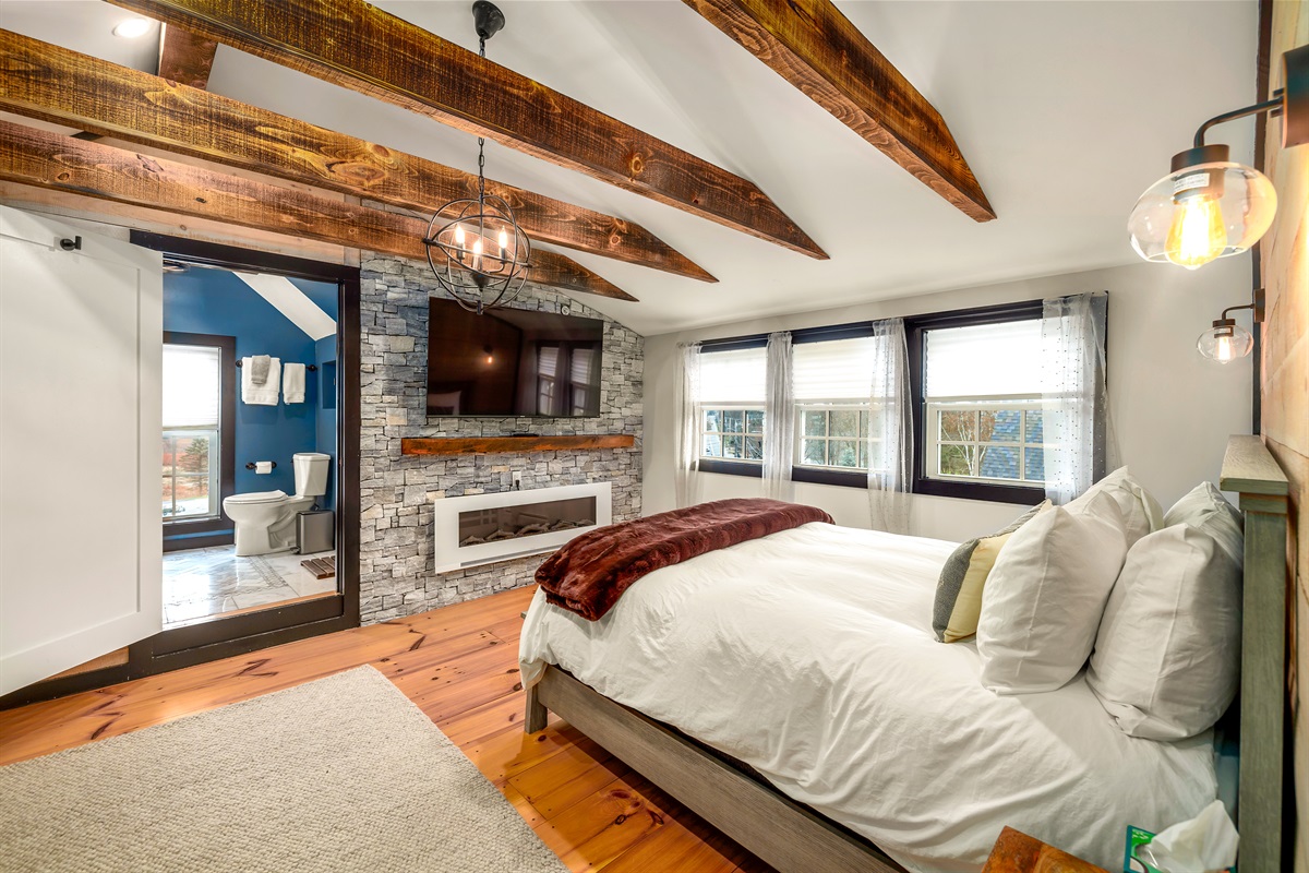 Primary bedroom with king bed and ensuite bathroom