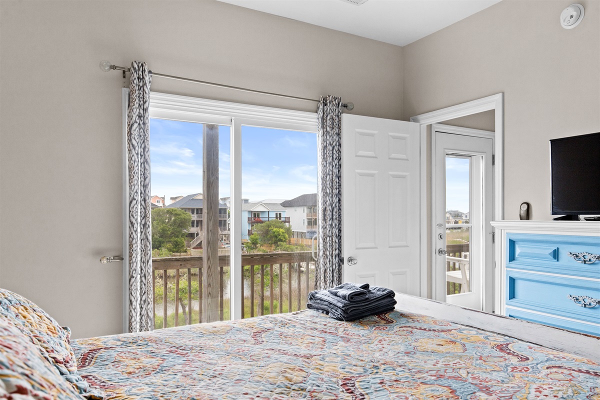 Private balcony access with peaceful neighborhood views