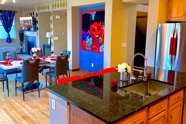 A full view of the kitchen counter and the living and dining area