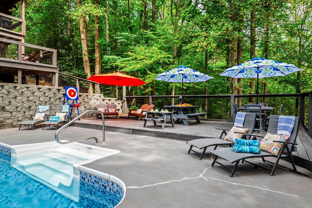 Watch sunlight filter through the trees as you lounge by the pool, completely enveloped in serenity.