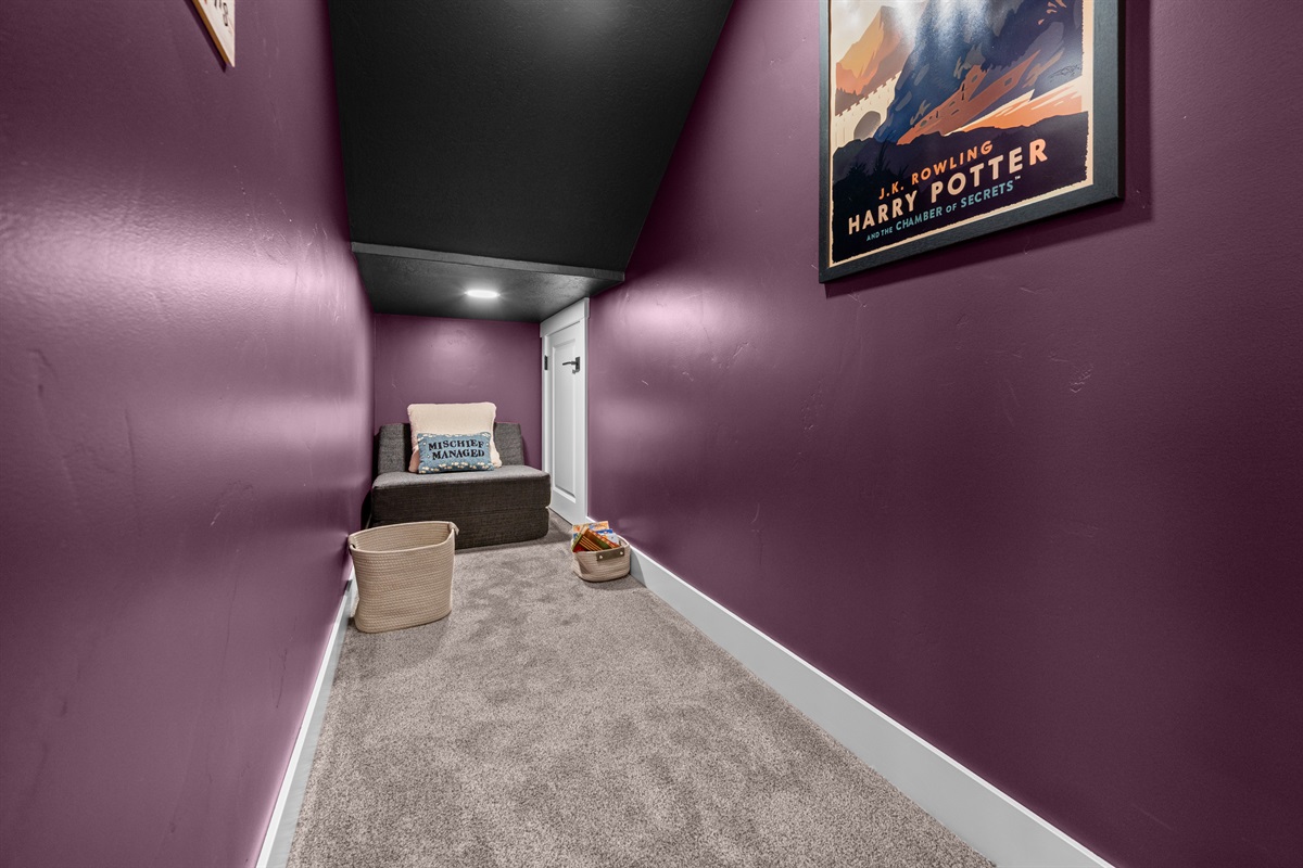 Charming “Wizard” nook under the stairs — a kid-favorite hideaway!