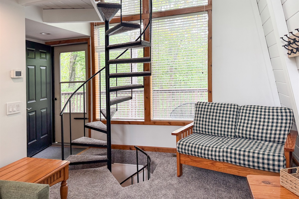 Spiral staircase going into the loft and basement