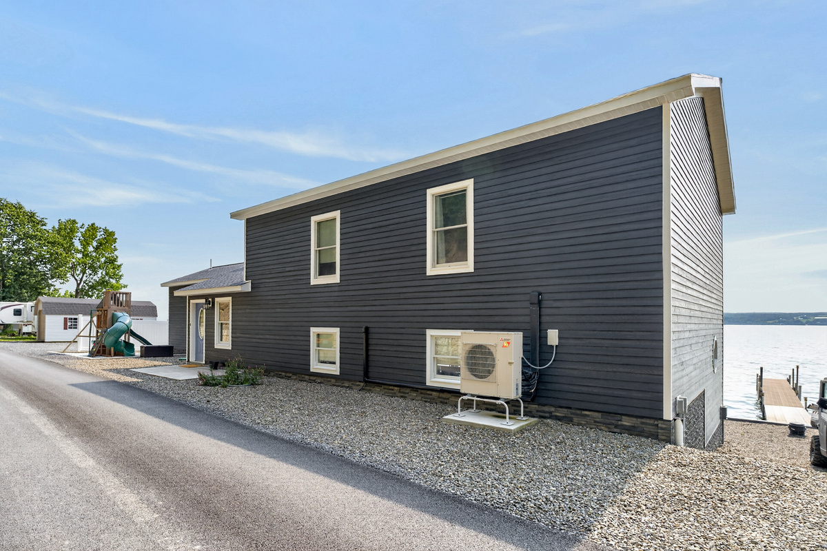 Side exterior with gravel driveway