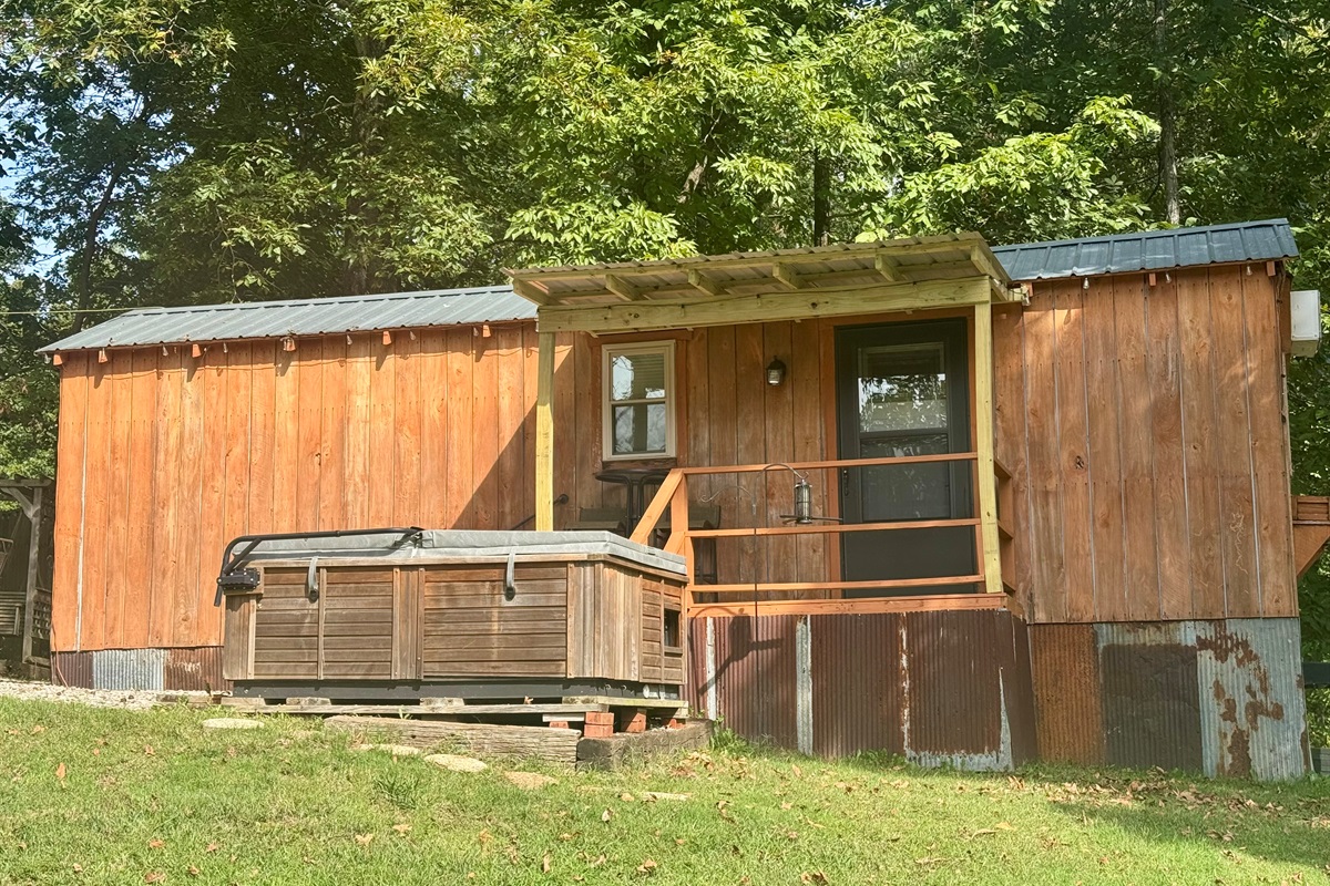 Front view of cabin and hot tub 