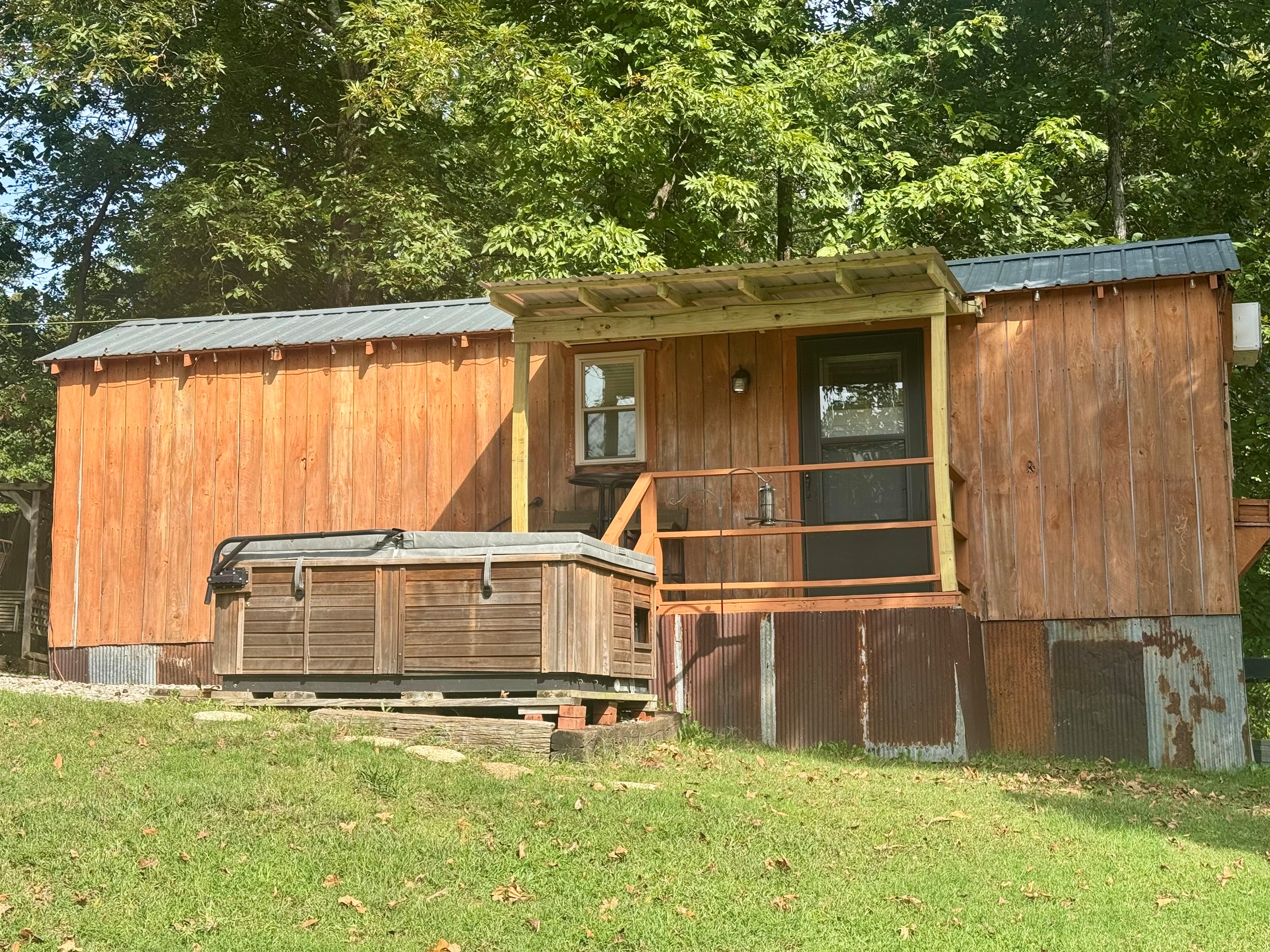 Front view of cabin and hot tub 