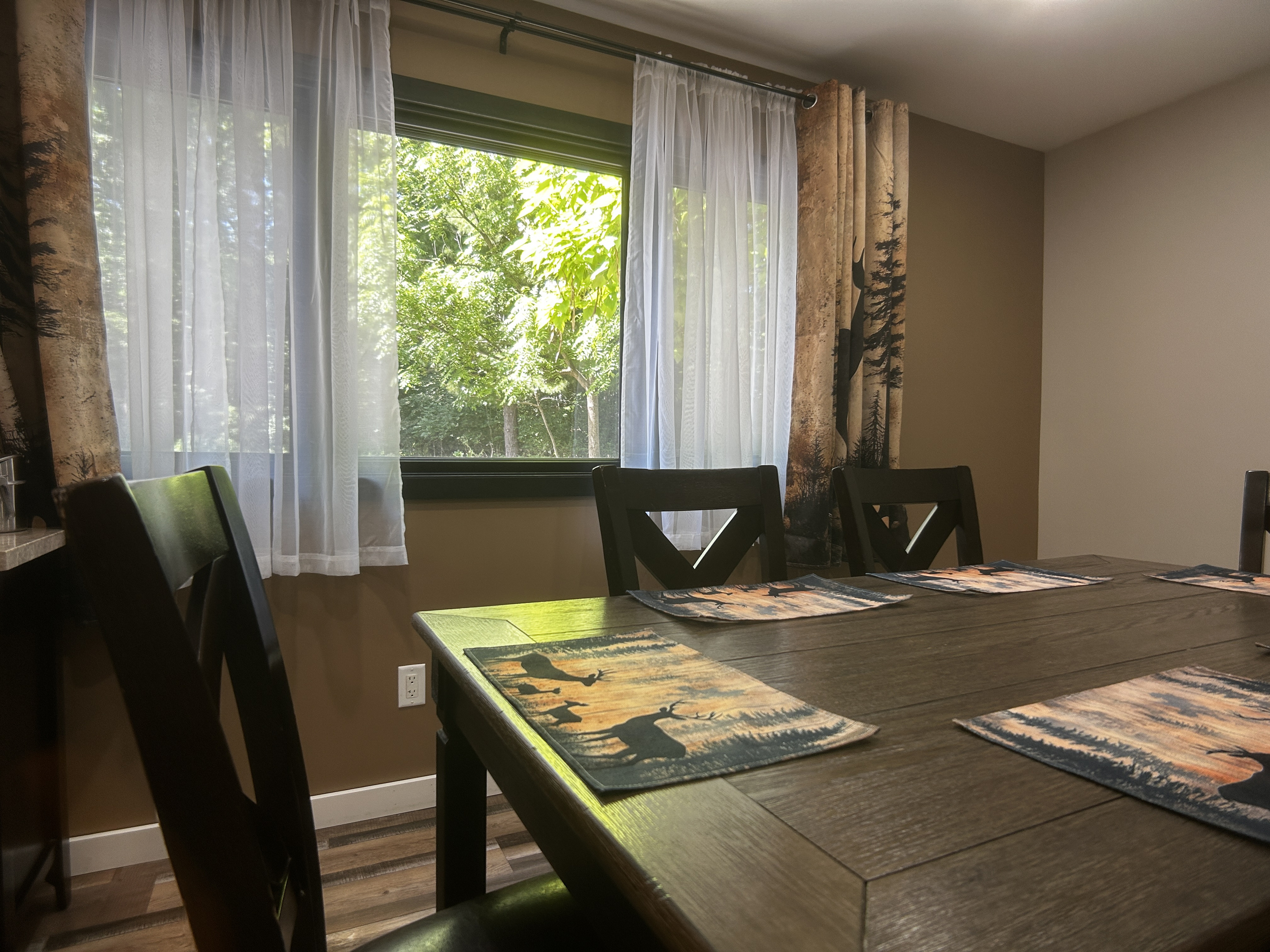 Watch deer in the front yard while eating at the dining room table.