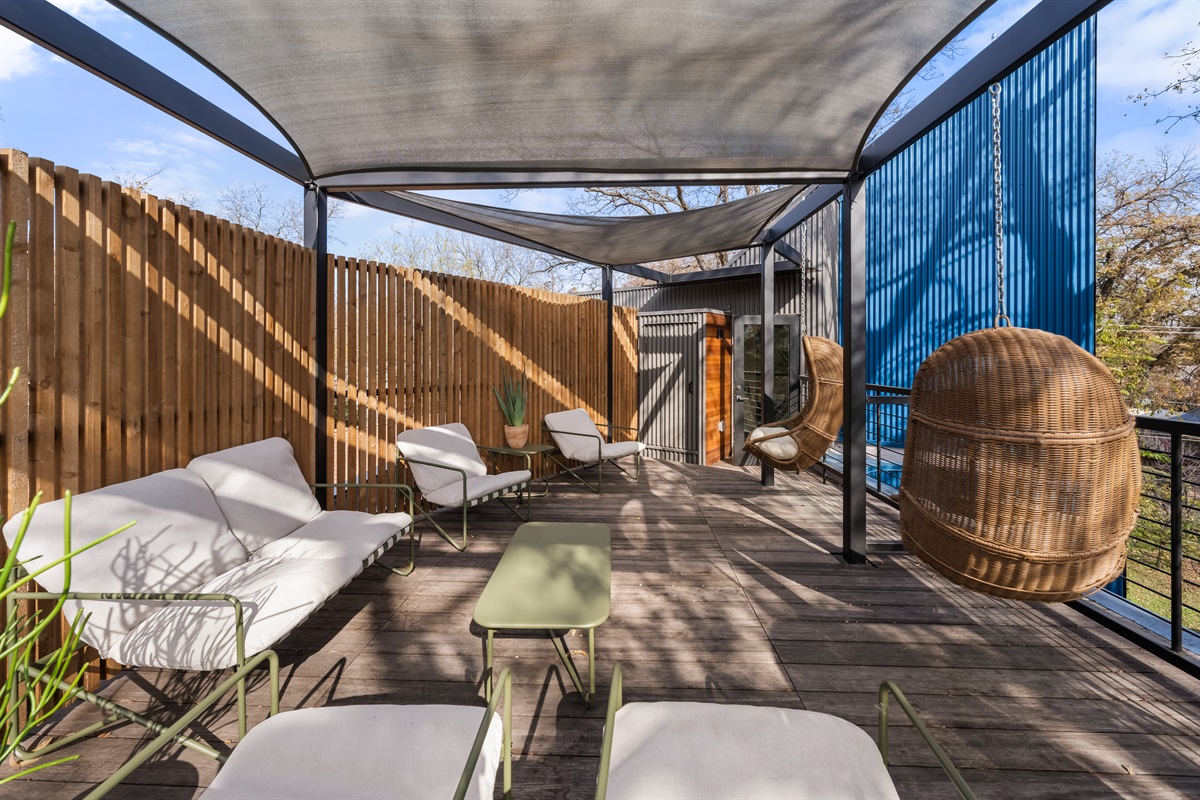 Spacious, modern terrace designed for lounging and socializing, featuring cozy seating and a peaceful outdoor atmosphere.