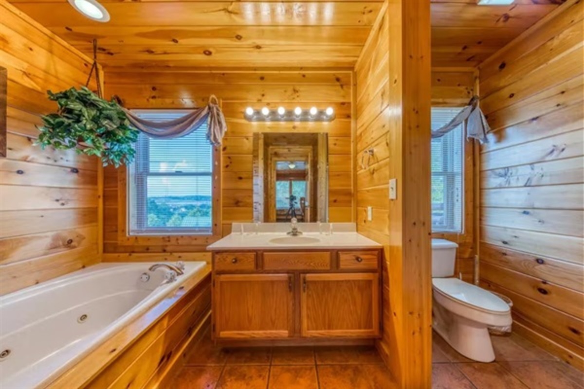 Unwind in a private ensuite bathroom with a jetted tub that invites long soaks after full days together.